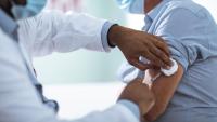 Man receive vaccination during medical exam